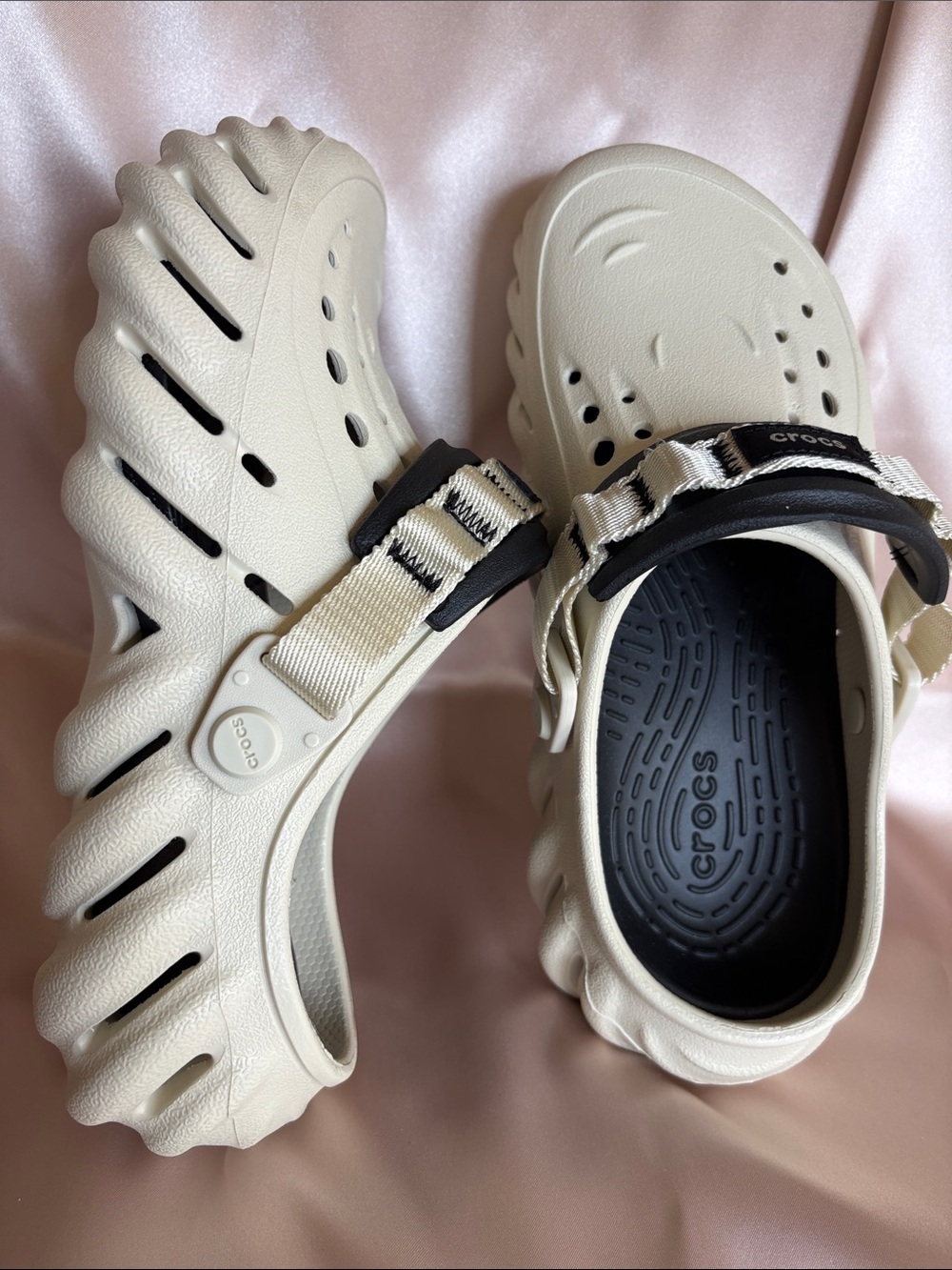 CROCS Echo Clogs feature a Bone and Black colorway with a distinct chunky